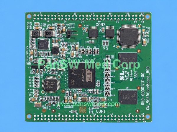 COMEN core circuit boards with foreground PCB marked 050-0001731-00 and CM_9G45CoreBoard_B00